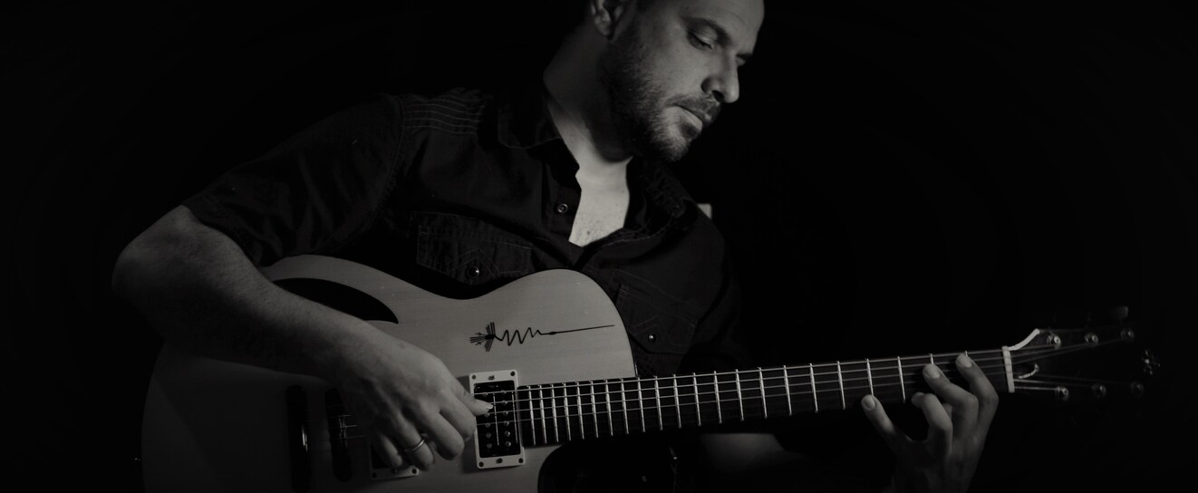 José Allende performing with his guitar